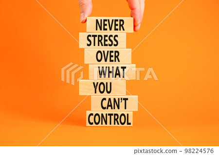 Never stress symbol. Concept words Never stress what you can not control on wooden blocks. Beautiful orange background copy space. Businessman hand. Business control motivational never stress concept. Never stress symbol. Concept words Never stress what you can not control on wooden blocks. Beautiful orange background copy space. Businessman hand. Business control motivational never stress concept. 98224576