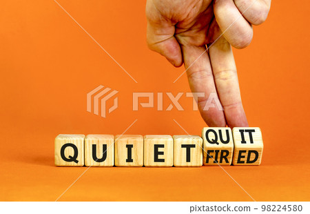 Quiet quit or fired symbol. Concept words Quiet quit and Quiet fired on wooden cubes. Businessman hand. Beautiful orange table orange background. Business quiet quit or fired concept. Copy space. Quiet quit or fired symbol. Concept words Quiet quit and Quiet fired on wooden cubes. Businessman hand. Beautiful orange table orange background. Business quiet quit or fired concept. Copy space. 98224580