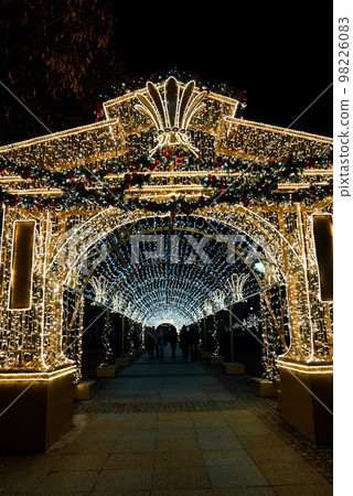 Magical Christmas market in Warsaw with people around buying presents. Christmas spirit in the old town of Warsaw. Magical Christmas market in Warsaw with people around buying presents. Christmas spirit in the old town of Warsaw. 98226083