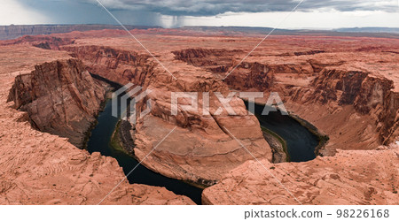 Panorama of Horseshoe Bend, Page Arizona. The Colorado River and a land mass made of orange sandstone. Made of twenty-three images, not one hundred percent accurate for perspective. Panorama of Horseshoe Bend, Page Arizona. The Colorado River and a land mass made of orange sandstone. Made of twenty-three images, not one hundred percent accurate for perspective. 98226168