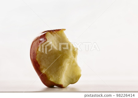 Red eaten apple studio shot Red eaten apple studio shot 98226414