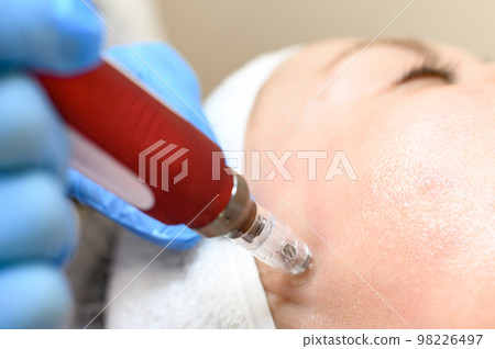 The process of rejuvenation and moisturizing with the help of the darsonval cosmetology device. The process of rejuvenation and moisturizing with the help of the darsonval cosmetology device. 98226497