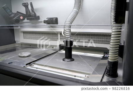 Powder part of 3d printer. Process of pouring polyamide powder through hose into working chamber of 3D printer for printing. Industrial equipment Modern 3D printing additive progressive technology MJF Powder part of 3d printer. Process of pouring polyamide powder through hose into working chamber of 3D printer for printing. Industrial equipment Modern 3D printing additive progressive technology MJF 98226816