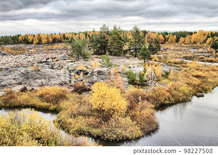 Exceptional view of the dry rocky riverbed and Northern autumn Exceptional view of the dry rocky riverbed and Northern autumn 98227508