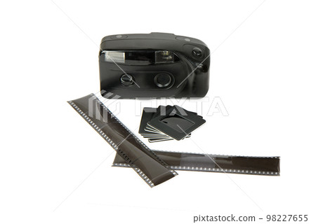 Old camera, film and slides isolated on white. 98227655