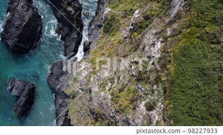 Seashore, view perpendicular from above. Beautiful sea rocks. The edge of the Atlantic Ocean. A natural attraction. Drone point of view. Seashore, view perpendicular from above. Beautiful sea rocks. The edge of the Atlantic Ocean. A natural attraction. Drone point of view. 98227933