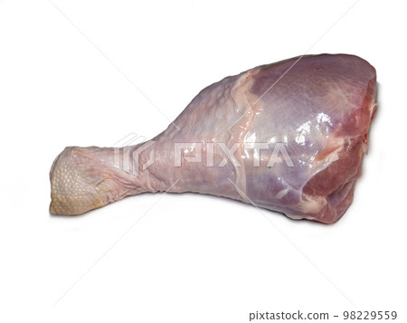 Turkey drumstick  in spices  on white background. Poultry meat. Turkey leg. Juicy meat is waiting to be cooked. 98229559