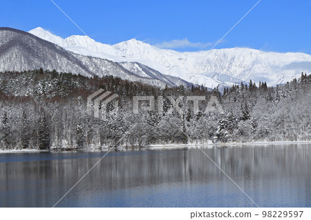 Lake Aoki in winter and Hakuba Miyama Lake Aoki in winter and Hakuba Miyama 98229597
