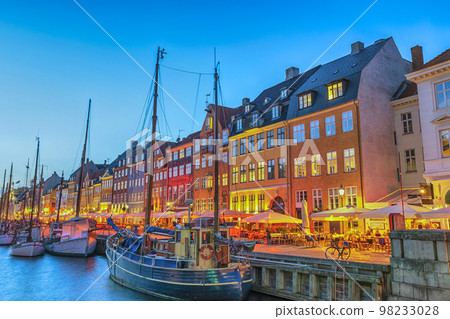Copenhagen Denmark, night city skyline at Nyhavn harbour with colourful house Copenhagen Denmark, night city skyline at Nyhavn harbour with colourful house 98233028