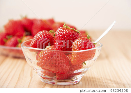 A lot of strawberries on a glass plate A lot of strawberries on a glass plate 98234308