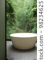 Relax bathtub with natural view in bathroom 98234625