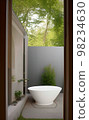 Relax bathtub with natural view in bathroom 98234630