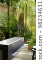 Relax bathtub with natural view in bathroom 98234631
