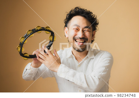 bearded man with tambourine bearded man with tambourine 98234748