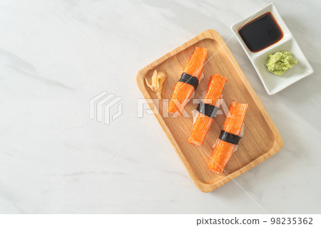 Crab Stick Sushi on wood plate 98235362
