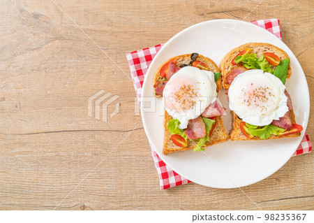 whole wheat bread toasted with vegetable, bacon and egg whole wheat bread toasted with vegetable, bacon and egg 98235367