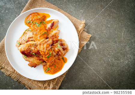 grilled chicken steak with red curry sauce grilled chicken steak with red curry sauce 98235598