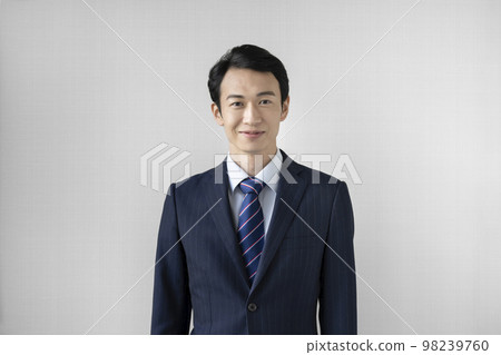 A portrait of a businessman in his thirties looking at the camera A portrait of a businessman in his thirties looking at the camera 98239760