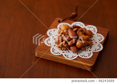 Various nuts on cute lace paper Various nuts on cute lace paper 98241689