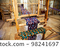 Handmade wooden loom to create national silk trani in Bukhara in Uzbekistan. 05.05.2019 98241697