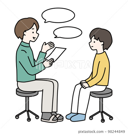 A child about elementary school who talks with a teacher 98244849