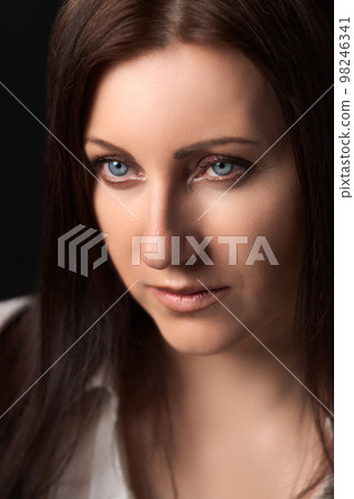 Portrait of Caucasian ethnicity adult woman forty years old. Beautiful female human face of brunette with gray eyes. Soft selective focus, deep-of-field of eyes. Portrait of Caucasian ethnicity adult woman forty years old. Beautiful female human face of brunette with gray eyes. Soft selective focus, deep-of-field of eyes. 98246341