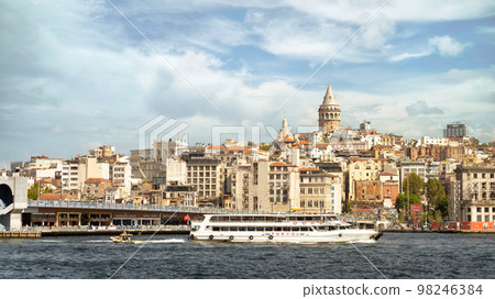 Ferry boat sailing in Bosphorus, with background of Galata Bridge and Galata Tower, Istanbul, Turkey 98246384