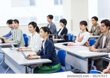 Young people taking lectures 98247017