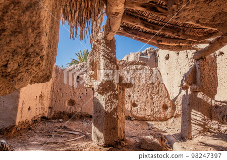 An old kasbah built by the Berbers, with traditional mud brick architecture and intricate tilework 98247397