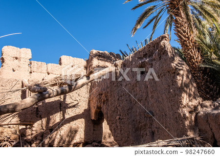 An old kasbah built by the Berbers, with traditional mud brick architecture and intricate tilework 98247660