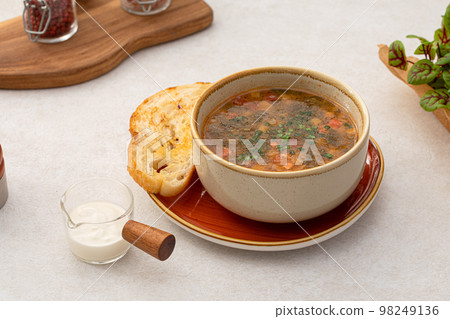 Portion of sorrel soup with grilled veal Portion of sorrel soup with grilled veal 98249136