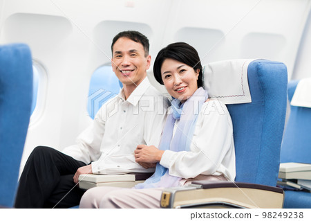 Middle-aged couple on board Middle-aged couple on board 98249238