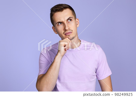 thoughtful man holding arms folded, touching chin with hand thoughtful man holding arms folded, touching chin with hand 98249925