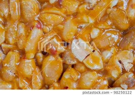 Caramelized nuts fried in honey - granola peanut bar - close up, top view 98250122