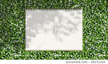 花園的背景和帶有清新葉子輪廓的素描本 98252263