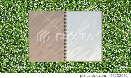 Green garden and sketchbook background with shadow of the rising sun 98252681
