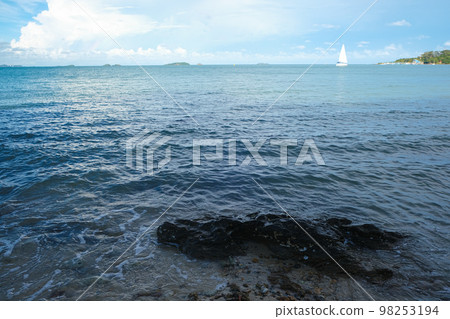 White sailboat on sea bay blue sky with cloud 98253194