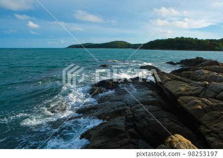Rocky sea bach wave against blue sky Rocky sea bach wave against blue sky 98253197