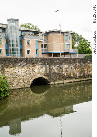 Historic red brick buildings along the River Thames in the city of Oxford outside London 98253346