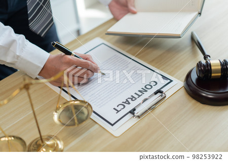 Law consultancy concept A male lawyer making clear of some details by adding clearer description on the contract by himself. Law consultancy concept A male lawyer making clear of some details by adding clearer description on the contract by himself. 98253922