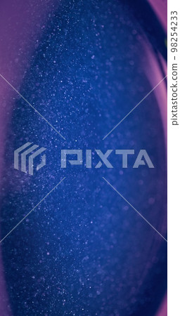 Defocused glitter texture. Bokeh light. Universe stardust. Blur neon blue pink color sparkle glow futuristic abstract background with free space. Defocused glitter texture. Bokeh light. Universe stardust. Blur neon blue pink color sparkle glow futuristic abstract background with free space. 98254233