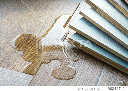 Laminate and water. Wooden floors are impervious to moisture. 98254741