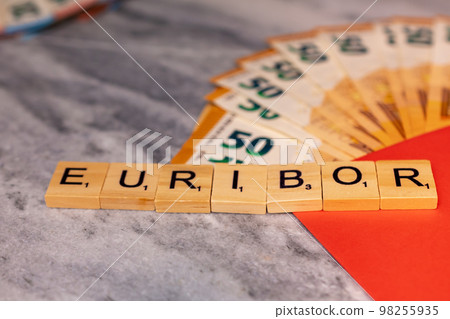 Word EURIBOR Is Written In Wooden Letters, Near Part Of 50 Euro Banknotes. Word EURIBOR Is Written In Wooden Letters, Near Part Of 50 Euro Banknotes. 98255935