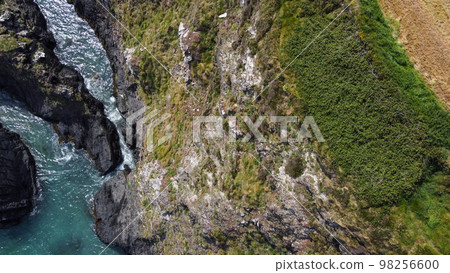 Seashore, view perpendicular from above. Beautiful sea rocks. The edge of the Atlantic Ocean. A natural attraction. Aerial photo. Seashore, view perpendicular from above. Beautiful sea rocks. The edge of the Atlantic Ocean. A natural attraction. Aerial photo. 98256600