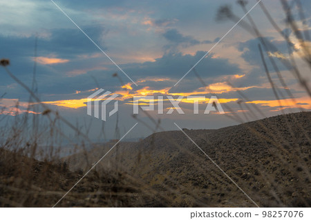 Colorful sunset in the highlands Colorful sunset in the highlands 98257076