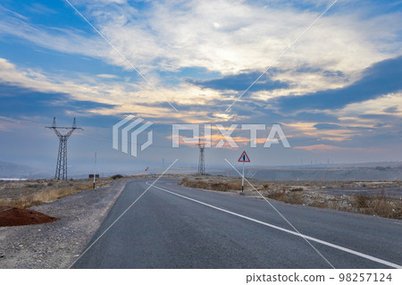 Beautiful sunset on a country road 98257124