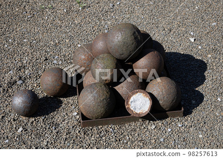 Close-up at Pile of iron cannon balls Close-up at Pile of iron cannon balls 98257613