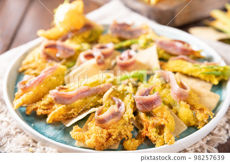 Pumpkin flowers fried with anchovies and cheese 98257639