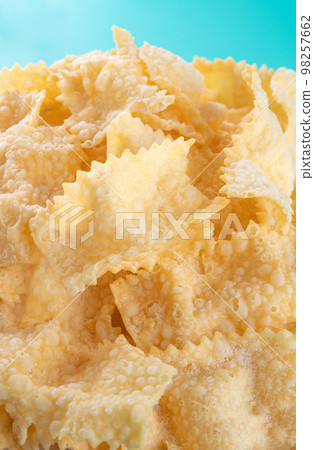 Sfrappole or chiachiere or angel wings background. Sfrappole or chiachiere or angel wings background. 98257662