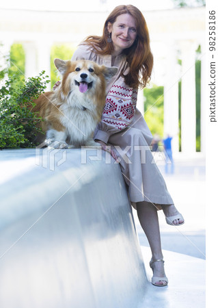 girl and dog walking 98258186